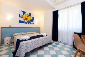 Postel nebo postele na pokoji v ubytování Hotel Villa Rita