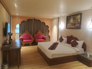 Postel nebo postele na pokoji v ubytování Hotel Seven Stone Bhilwara