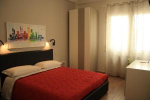 Postel nebo postele na pokoji v ubytování San Andreas Suites