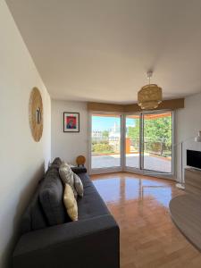 Ruang duduk di Coralline, Appartement lumineux à 2 pas de la mer.