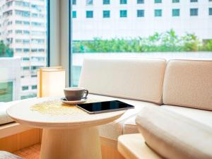 Χώρος καθιστικού στο AKI Hong Kong - MGallery