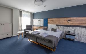 Postel nebo postele na pokoji v ubytování UPA Medical SPA