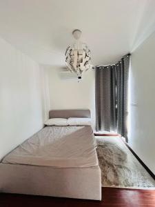 En eller flere senge i et værelse på House For Rent in Lapu-Lapu City, Cebu