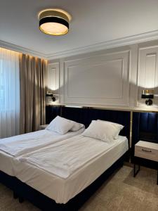 Postel nebo postele na pokoji v ubytování Moris Beach Hotel