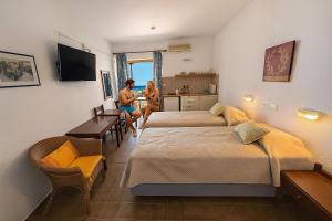 Postel nebo postele na pokoji v ubytování ZAMBELLA APARTMENTS