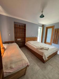 Postel nebo postele na pokoji v ubytování Etno Rekreacia Tabatadze, With in Door & Out door pool