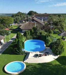 an overhead view of two swimming pools in a yard at Holbina Trei Bibani - Delta Dunarii in Dunavăţu de Jos