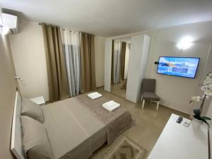 Телевизор и/или развлекательный центр в Mediterraneo b&b Cirò Marina