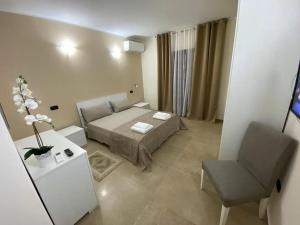 Кровать или кровати в номере Mediterraneo b&b Cirò Marina