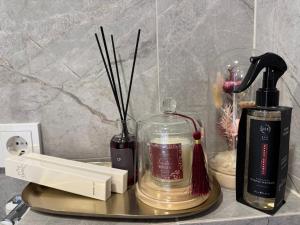 a counter top with a bottle of alcohol and a blender at Baltic Avenue Duo in Klaipėda