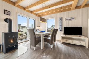 Μια τηλεόραση ή/και κέντρο ψυχαγωγίας στο Ferienhaus Jette Olpenitz