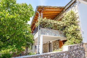 a building with plants on the side of it at Theologos Nest in Theológos