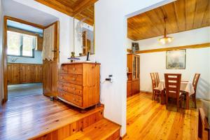 a kitchen with wooden floors and a dining room at Theologos Nest in Theológos +27 photos