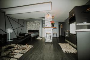 a living room with a couch and a table at Loveroom&Spa Dreamroom in Tournon-sur-Rhône