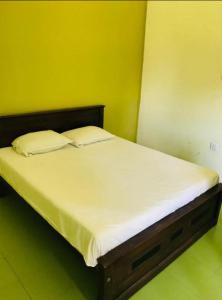 Postel nebo postele na pokoji v ubytování Araliya Hotel
