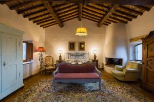 a living room with a couch and a fireplace at Florence Countryside Giogoli a place to be in Scandicci