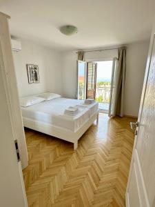 Posteľ alebo postele v izbe v ubytovaní Apartman Adriatic Pavlinovic - Makarska