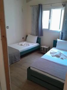 Postel nebo postele na pokoji v ubytování Logaki house