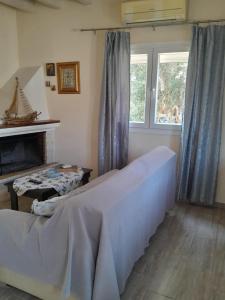 Postel nebo postele na pokoji v ubytování Logaki house