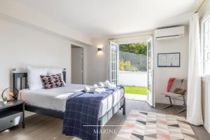 Łóżko lub łóżka w pokoju w obiekcie Villa Olaina - Villa climatisée avec piscine