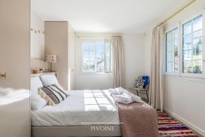 Łóżko lub łóżka w pokoju w obiekcie Villa Olaina - Villa climatisée avec piscine
