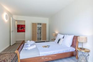 Łóżko lub łóżka w pokoju w obiekcie Villa Olaina - Villa climatisée avec piscine