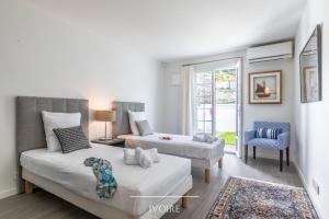 Łóżko lub łóżka w pokoju w obiekcie Villa Olaina - Villa climatisée avec piscine