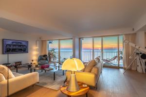 a living room with a view of the ocean at Sunset - Vue exceptionnelle sur l'océan in Biarritz +21 photos