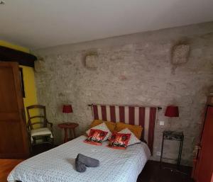 Posteľ alebo postele v izbe v ubytovaní Dans la Cité de Rocamadour L'Oustal de Beline