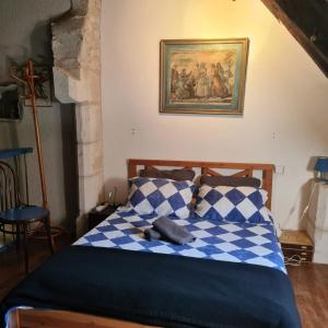 Posteľ alebo postele v izbe v ubytovaní Dans la Cité de Rocamadour L'Oustal de Beline + 22 fotografií