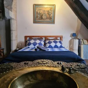 Posteľ alebo postele v izbe v ubytovaní Dans la Cité de Rocamadour L'Oustal de Beline