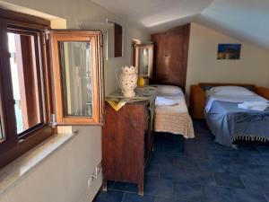 Posteľ alebo postele v izbe v ubytovaní MiraMare Residence Cefalú