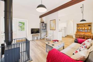 a living room with a couch and a stove at Host & Stay - Lane Farm Cottage in Easington +16 photos