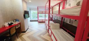 Postel nebo postele na pokoji v ubytování 喜園旅館Ximen Garden Inn + 37 fotografií