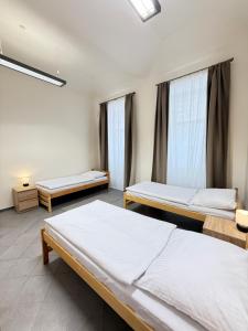 Postel nebo postele na pokoji v ubytování Sleep & Go Praha 5 Anděl + 16 fotografií