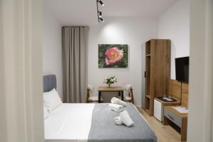 Postel nebo postele na pokoji v ubytování Hotel La Rosa