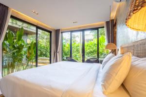 Ένα ή περισσότερα κρεβάτια σε δωμάτιο στο 5 BR Retreat Villa - Beach Access