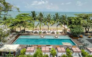 an overhead view of a pool with chairs and a beach at Queenco Entertainment Resort in Sihanoukville