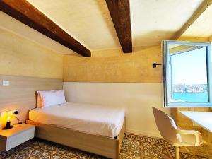 Krevet ili kreveti u jedinici u okviru objekta Cove 532 by Savynomad Harbour Residences wow View