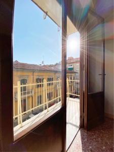 a view from a window of a balcony at Comodo e Pratico nel Cuore pulsante di Pisa in Pisa