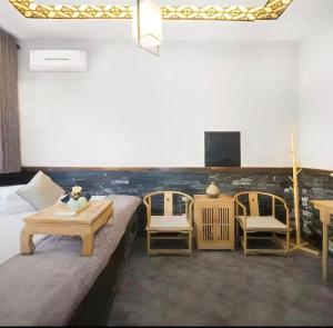 Зона вітальні в Pingyao Yihao Inn