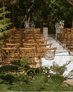 a row of chairs at a wedding ceremony at Belle Vallee Guestroom 1 in Wellington +5 photos