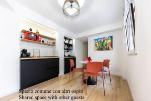 a kitchen with a table and chairs in a room at Casa Zio Lele in Cefalù