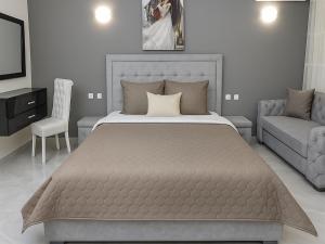 A bed or beds in a room at Парк Апарт-Хотел Виктория 1