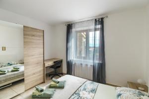 Łóżko lub łóżka w pokoju w obiekcie Villa Krasa sea view apartmants with pool