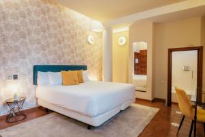 Postel nebo postele na pokoji v ubytování Hotel Cetina Palacio Ayala Berganza