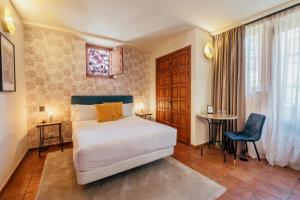 Postel nebo postele na pokoji v ubytování Hotel Cetina Palacio Ayala Berganza
