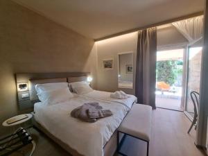 a bedroom with a bed with a towel on it at Villa dell'Olivo Bianco in Castion Veronese +49 photos