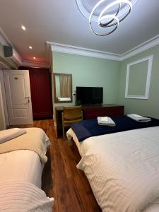 Postel nebo postele na pokoji v ubytování Flored Hotel