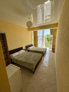 Postel nebo postele na pokoji v ubytování GRANAT Hotel